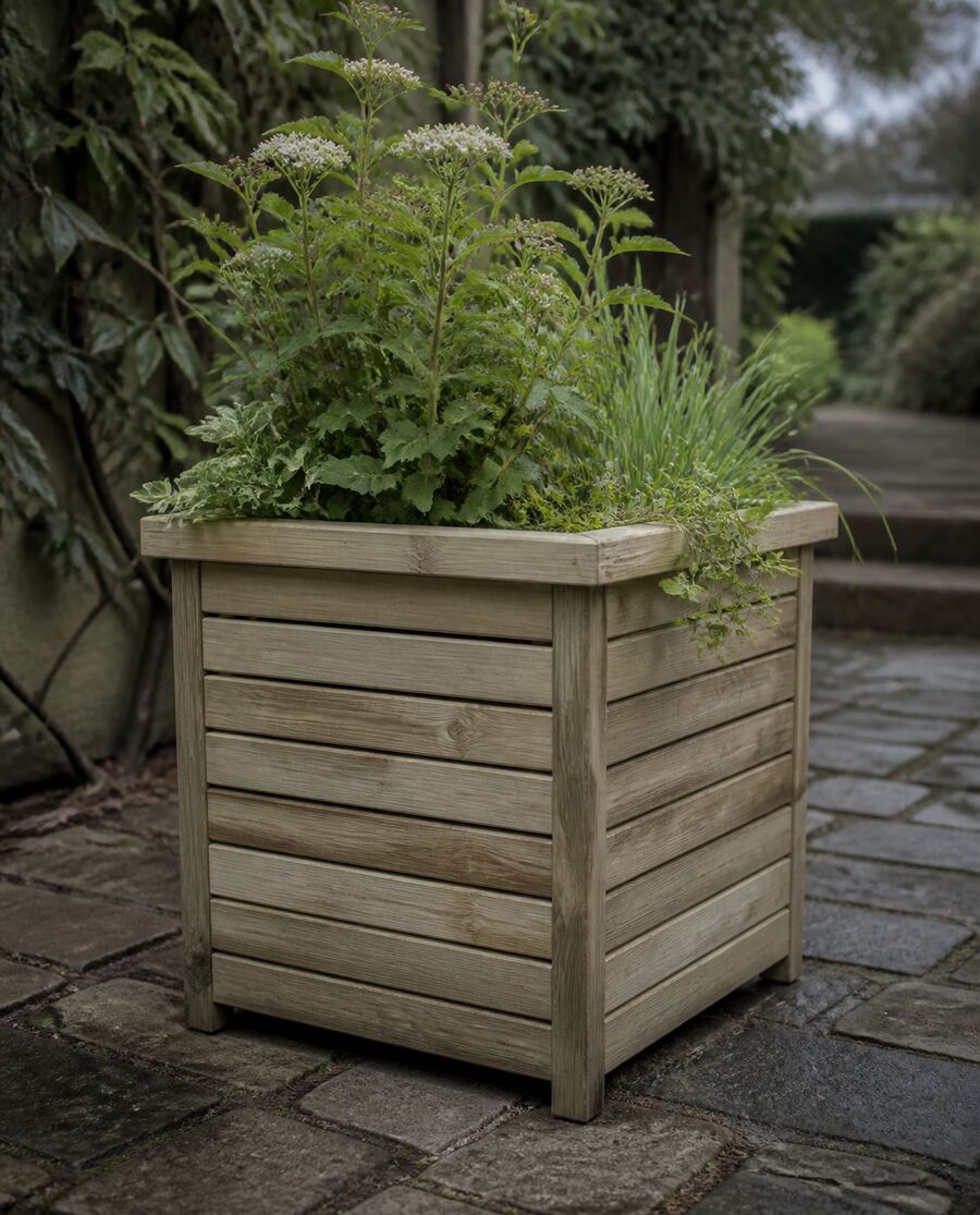 A handmade slatted timber garden planter on a stone path